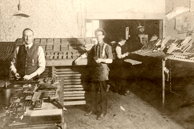 Photograph of Paxton, Sullenberger, and Evans in Composing Room at Paxton and Evans Printers, 1905