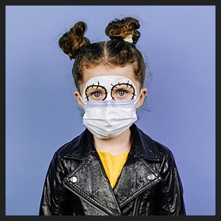 Girl with painted face, protective mask