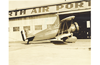 Curtiss F8C-7 Biplane Outside Fort Worth Airport (Meacham Field) Hangar, photograph, undated