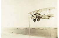 NAT US Mail Express Biplane in Air Over Terminal, photograph, circa 1920s