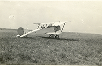 Small Biplane in Field, photograph, undated