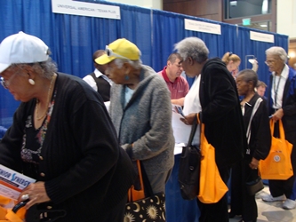 Attendees visiting exhibitors