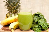 Smoothie with spinach, banana, and pineapple