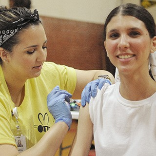 young woman getting vaccinated